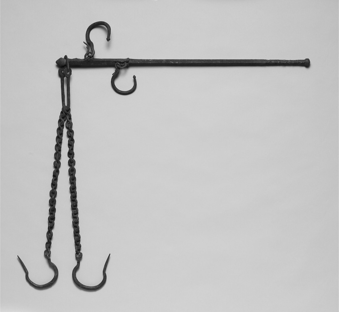A bronze steelyard: a weighing beam with hooks and a chain